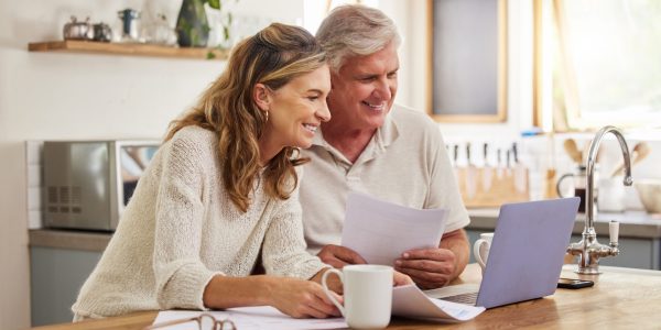 Retirement, investment and couple on laptop and paperwork for online, digital banking application planning pension. Elderly people doing asset management, check contract information, finance or will