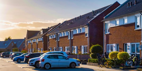 Dutch Suburban area with modern family houses, newly built modern family homes in the Netherlands, dutch family houses in the Netherlands, row of newly built houses in the Netherlands at sunset