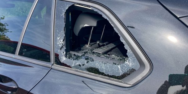 Kijkduin, The Hague the Netherlands Europe - April 14 2024: thieves break car window to steal goods inside parked vehicle